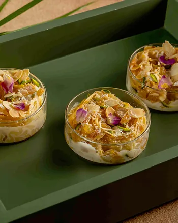 Um Ali jars on a green tray